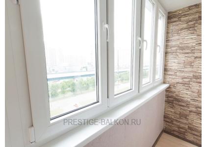 Тёплое остекление балкона профилем КВЕ и комбинированной отделкой пластиком и деревом в Мытищах