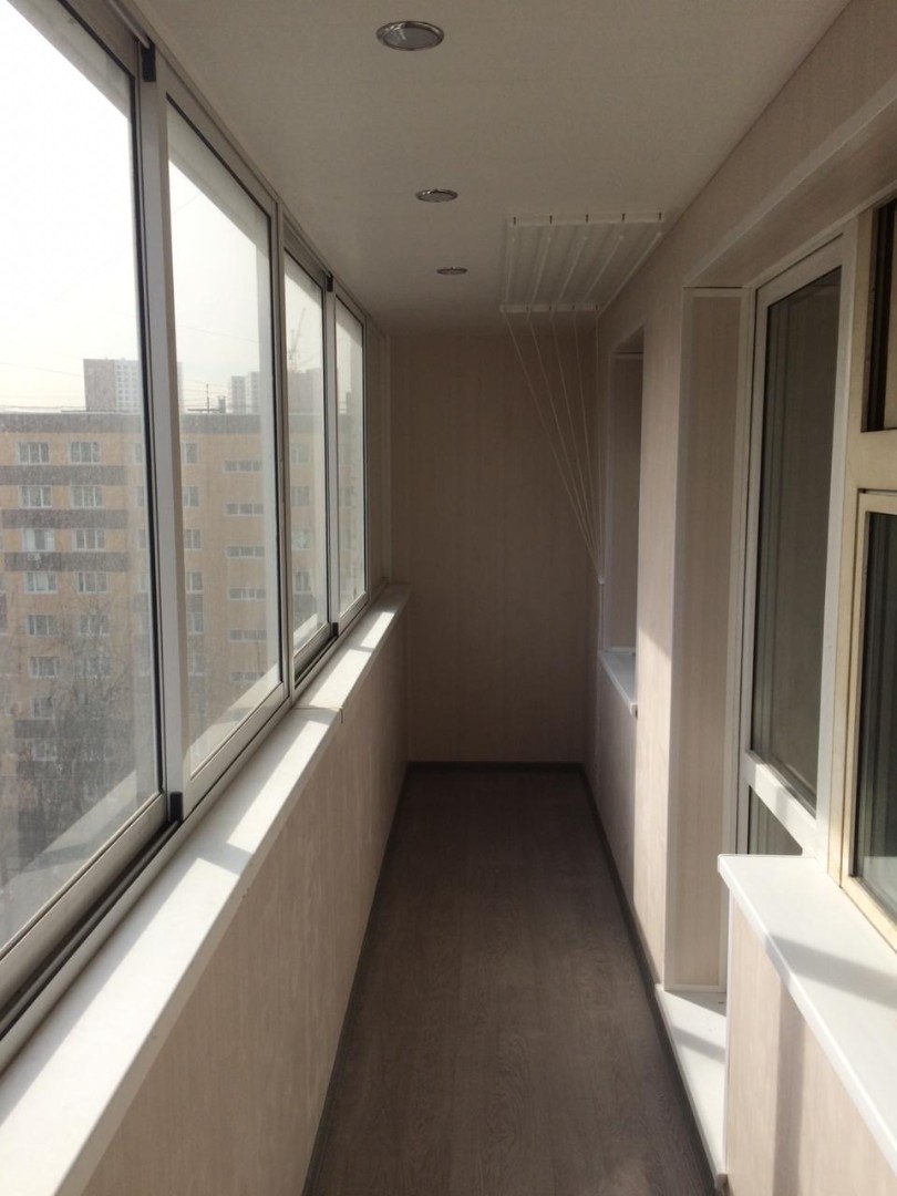 Теплое остекление балкона профилем KBE и установка сушилки в Мытищах